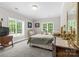 Bright bedroom with large windows, vintage furniture, and plush bedding at 133 43Rd Avenue Nw Ln, Hickory, NC 28601