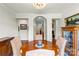Elegant dining room featuring a chandelier, beautiful wood floors, and open doorways at 133 43Rd Avenue Nw Ln, Hickory, NC 28601