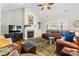 Inviting living room with a fireplace, a ceiling fan, and a comfortable leather sectional at 133 43Rd Avenue Nw Ln, Hickory, NC 28601