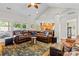 Spacious living room with a leather sectional sofa, decorative area rug, and plenty of natural light at 133 43Rd Avenue Nw Ln, Hickory, NC 28601