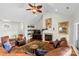 Comfortable living room with a fireplace, brown leather sofa, area rug, and accent chairs at 133 43Rd Avenue Nw Ln, Hickory, NC 28601