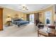 Spacious main bedroom boasts a ceiling fan, a sitting area, and barn doors to the workout room at 133 43Rd Avenue Nw Ln, Hickory, NC 28601