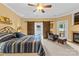 Comfortable main bedroom featuring a fireplace, a ceiling fan, and barn doors to the workout room at 133 43Rd Avenue Nw Ln, Hickory, NC 28601