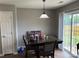 Cozy dining area with access to the backyard, perfect for meals and gatherings at 1421 Piney Church Rd, Concord, NC 28025