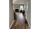 Inviting view of the living room and fireplace from the hallway in neutral tones at 1421 Piney Church Rd, Concord, NC 28025