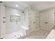 Modern bathroom boasting a glass enclosed shower with bench and subway tile, alongside a double door entry at 1522 Barberry Ct, Charlotte, NC 28211