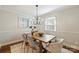 Dining room features a wooden table, chandelier, and light gray walls at 1522 Barberry Ct, Charlotte, NC 28211
