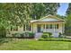 Charming brick home with a welcoming front porch and beautifully landscaped front yard at 1522 Barberry Ct, Charlotte, NC 28211