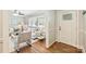 Cozy living room with hardwood floors, neutral paint, and large windows for natural light at 1522 Barberry Ct, Charlotte, NC 28211