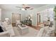Open-concept living room with hardwood floors leading to the dining and kitchen areas at 1522 Barberry Ct, Charlotte, NC 28211