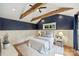 Bedroom with vaulted ceiling, exposed beams, board and batten, and hardwood floors at 1522 Barberry Ct, Charlotte, NC 28211
