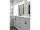 Modern bathroom showcasing a double vanity with modern fixtures, mirrors, and a glass shower at 15301 Marsh Field Ct, Huntersville, NC 28078