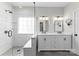 Modern bathroom featuring a double sink vanity, glass shower, and sleek design at 15301 Marsh Field Ct, Huntersville, NC 28078