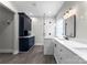 Bathroom featuring modern fixtures, white marble, and a glass-enclosed shower at 15301 Marsh Field Ct, Huntersville, NC 28078