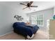Bedroom with ceiling fan, neutral paint, carpet floors, and large window at 15301 Marsh Field Ct, Huntersville, NC 28078