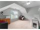 Spacious bedroom featuring carpet floors, neutral paint, and a comfortable chair at 15301 Marsh Field Ct, Huntersville, NC 28078