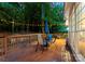 Outdoor deck area with dining set, bordered by lush greenery and privacy at 15301 Marsh Field Ct, Huntersville, NC 28078