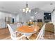 Open dining area connecting the kitchen and living room in an open concept home at 15301 Marsh Field Ct, Huntersville, NC 28078