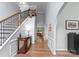 Grand foyer with soaring ceilings, hardwood floors, staircase and an archway leading to the living area at 15301 Marsh Field Ct, Huntersville, NC 28078