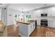 Gourmet kitchen with a large island, stainless steel appliances, and butcher block countertops at 15301 Marsh Field Ct, Huntersville, NC 28078