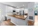 Kitchen with white cabinets, stainless appliances, wood countertops, and an island with a sink at 15301 Marsh Field Ct, Huntersville, NC 28078