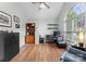 Bright office space with vaulted ceilings, hardwood floors, and a large window at 15301 Marsh Field Ct, Huntersville, NC 28078