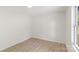 Bedroom featuring a window with natural light, wood flooring, and neutral walls at 1574 Mangum Dr, Lancaster, SC 29720