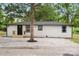 Charming single-story home features fresh exterior paint and a gravel-covered front yard at 1574 Mangum Dr, Lancaster, SC 29720