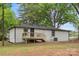 View of the home's exterior featuring a wooden deck and neutral-colored siding at 1574 Mangum Dr, Lancaster, SC 29720