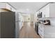 Spacious kitchen with stainless steel appliances, white cabinets, and modern finishes, creating a sleek and functional design at 1574 Mangum Dr, Lancaster, SC 29720