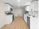 Bright kitchen features stainless appliances, white cabinets, and light countertops at 1574 Mangum Dr, Lancaster, SC 29720