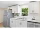 Bright kitchen with stainless steel appliances, white cabinets, subway tile backsplash, and modern countertops at 1574 Mangum Dr, Lancaster, SC 29720