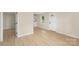 Bright living room featuring wood-look flooring, new paint, updated windows, and modern fixtures at 1574 Mangum Dr, Lancaster, SC 29720