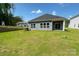 Well-maintained backyard with a lush green lawn and a covered patio, perfect for outdoor enjoyment at 1600 Baymont Ct, Stanley, NC 28164