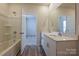 A secondary bathroom with a tub, and double sink vanity at 1600 Baymont Ct, Stanley, NC 28164