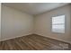 An additional bedroom offers wood floors, and neutral colors at 1600 Baymont Ct, Stanley, NC 28164