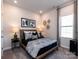 Cozy bedroom with a stylish bed, decorative lamps, neutral walls, and plush carpeting for a relaxing ambiance at 1600 Baymont Ct, Stanley, NC 28164