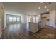 Bright, open-concept kitchen and living area features a large island and plenty of natural light at 1600 Baymont Ct, Stanley, NC 28164