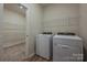 Convenient laundry room with washer, dryer, and shelving at 1600 Baymont Ct, Stanley, NC 28164
