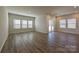 Spacious living room with hardwood floors, recessed lighting, and sliding glass doors to the backyard at 1600 Baymont Ct, Stanley, NC 28164