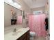 Stylish bathroom with decorative accents and a shower with a pink curtain at 1643 Essex Hall Dr, Rock Hill, SC 29730