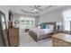 Spacious bedroom featuring a tray ceiling, large window, and comfortable decor at 1643 Essex Hall Dr, Rock Hill, SC 29730