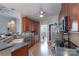 Cozy kitchen with warm wood cabinets, stainless appliances, and hardwood floors at 1643 Essex Hall Dr, Rock Hill, SC 29730