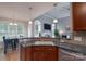Open kitchen design with granite countertops and adjacent dining and living areas at 1643 Essex Hall Dr, Rock Hill, SC 29730