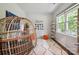 Cozy room with a unique wicker chair, bright window, and decorative accents at 17812 New Mark Ave, Charlotte, NC 28278