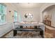 Formal dining room is well-lit and decorated with modern light fixture and decor at 17812 New Mark Ave, Charlotte, NC 28278