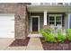 Inviting front porch with rocking chairs, stylish siding, and brick accents at 17812 New Mark Ave, Charlotte, NC 28278
