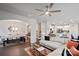 Open-concept living space with bright walls, fan, and view into dining and kitchen at 17812 New Mark Ave, Charlotte, NC 28278