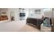Carpeted main bedroom features neutral walls, television, and large windows at 17812 New Mark Ave, Charlotte, NC 28278