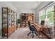 Bright home office with custom wood shelving, storage, and large window at 17812 New Mark Ave, Charlotte, NC 28278